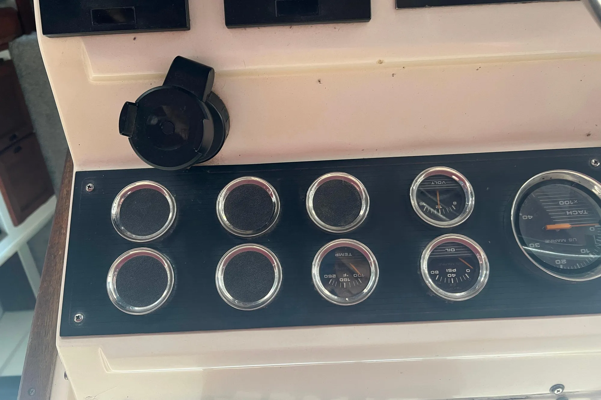 Dashboard of a 1986 Bayliner 4550 Motoryacht with gauges and controls.