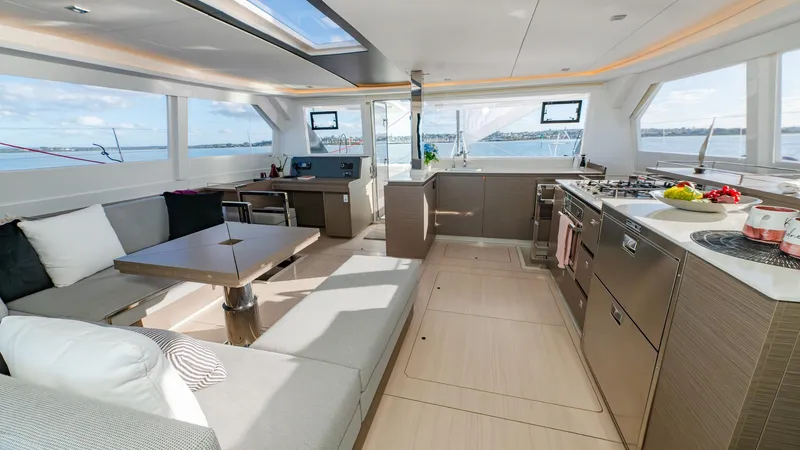  Yacht Photos Pics Luxurious interior of 2024 Leopard 50 yacht with modern kitchen and seating area.