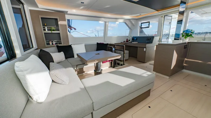  Yacht Photos Pics Luxurious interior of 2024 Leopard 50 yacht with modern seating and panoramic windows.