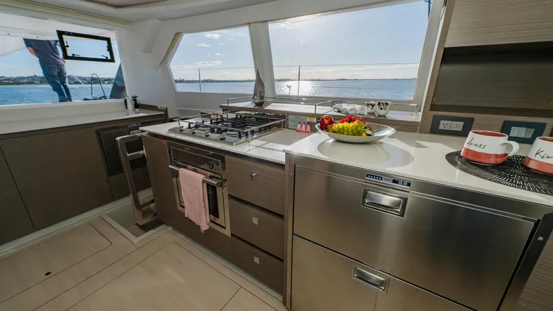  Yacht Photos Pics Modern kitchen interior on 2024 Leopard 50 yacht with ocean view.