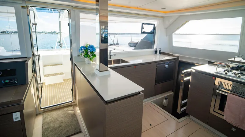  Yacht Photos Pics Luxurious interior of 2024 Leopard 50 yacht with modern kitchen and ocean view.