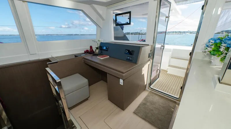  Yacht Photos Pics Interior of 2024 Leopard 50 yacht with modern navigation station and ocean view.