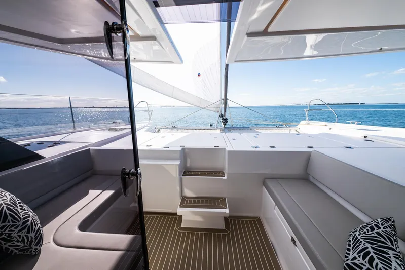  Yacht Photos Pics 2024 Leopard 50 yacht interior with ocean view, featuring modern seating and sleek design.