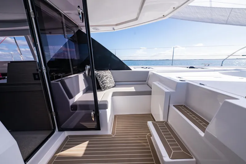  Yacht Photos Pics 2024 Leopard 50 yacht interior with modern seating and ocean view.