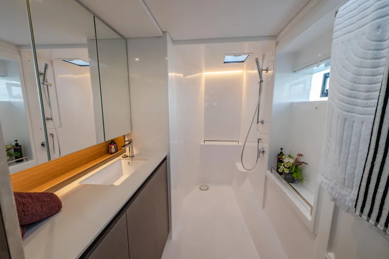 Yacht Photos Pics Modern bathroom in 2024 Leopard 50 yacht with sleek design and elegant fixtures.