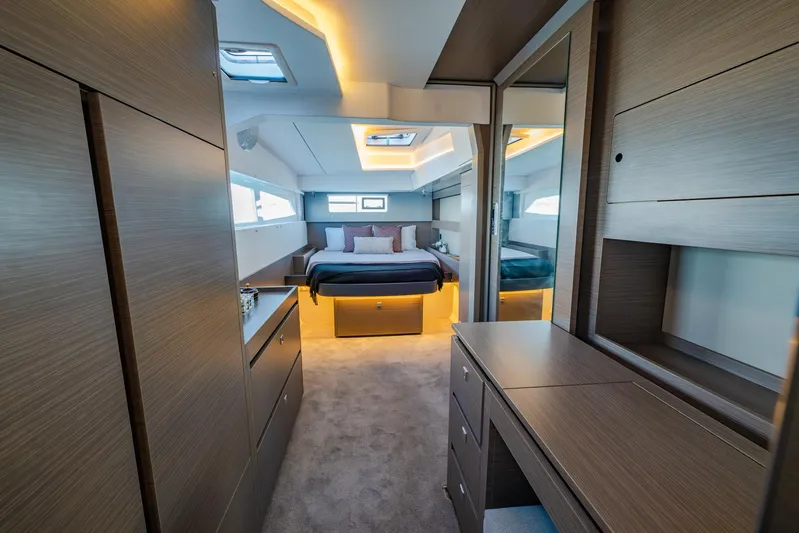  Yacht Photos Pics Luxurious interior of 2024 Leopard 50 yacht with modern bedroom design and ambient lighting.