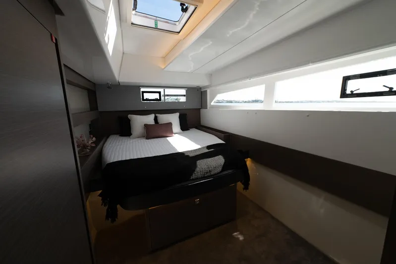  Yacht Photos Pics Luxurious bedroom interior of 2024 Leopard 50 yacht with skylight and modern design.