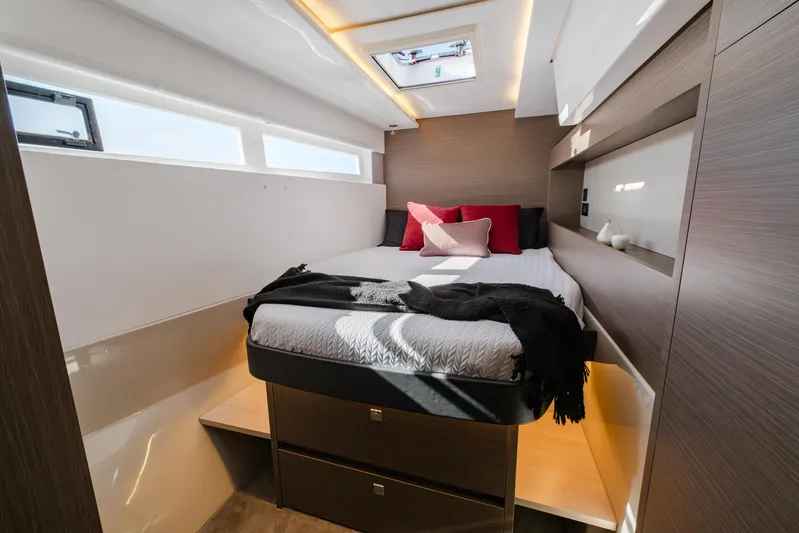  Yacht Photos Pics Luxurious bedroom interior of 2024 Leopard 50 yacht with modern design and skylight.