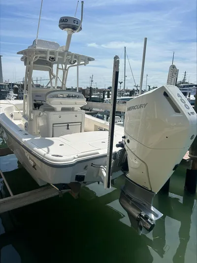  Yacht Photos Pics 2024 SeaVee 270Z boat with Mercury outboard motor docked in marina.