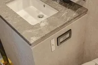Marble sink countertop in 2006 Arno Leopard 31 OPEN yacht bathroom.