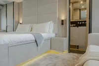 Luxurious bedroom interior on 2006 Arno Leopard 31 OPEN yacht, featuring modern design and ambient lighting.