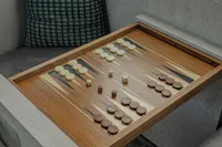 Backgammon board with dice and checkers on a luxury yacht, Arno Leopard 31 OPEN, 2006.