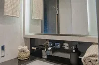 Luxurious bathroom interior on a 2006 Arno Leopard 31 OPEN yacht, featuring modern fixtures.