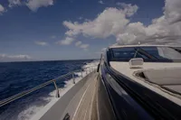 Luxury yacht Arno Leopard 31 OPEN cruising on open sea under clear skies.