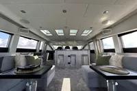 Luxurious interior of 2006 Arno Leopard 31 OPEN yacht with modern seating and skylights.