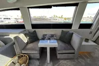 Interior of 2006 Arno Leopard 31 OPEN yacht with elegant seating and table.