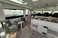 Luxurious interior of 2006 Arno Leopard 31 OPEN yacht with modern seating and elegant design.