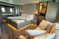 Luxurious bedroom interior of 2006 Arno Leopard 31 OPEN yacht with modern design and ambient lighting.