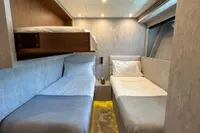 Interior cabin of 2006 Arno Leopard 31 OPEN yacht with twin beds and modern design.