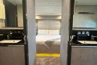 Luxurious bedroom with dual sinks on Arno Leopard 31 OPEN yacht, 2006 model.