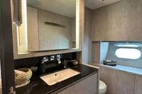 Luxurious bathroom in 2006 Arno Leopard 31 OPEN yacht with modern fixtures and porthole window.