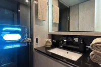 Luxurious bathroom in 2006 Arno Leopard 31 OPEN yacht with modern fixtures and elegant design.