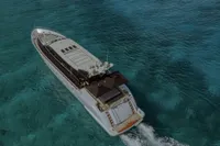 Aerial view of 2006 Arno Leopard 31 OPEN yacht cruising on clear blue water.