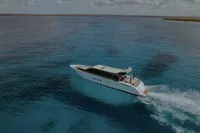 Aerial view of 2006 Arno Leopard 31 OPEN yacht cruising in clear blue waters.