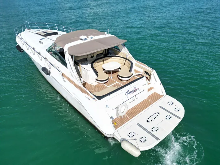  Yacht Photos Pics 1998 Sea Ray 500 Sundancer yacht cruising on clear blue water.