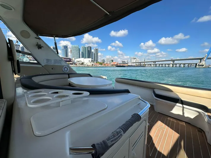  Yacht Photos Pics 1998 Sea Ray 500 Sundancer yacht interior with city skyline and ocean view.