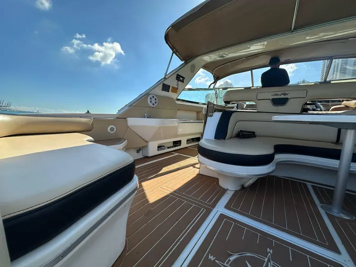  Yacht Photos Pics Luxurious 1998 Sea Ray 500 Sundancer interior with elegant seating and wooden flooring.