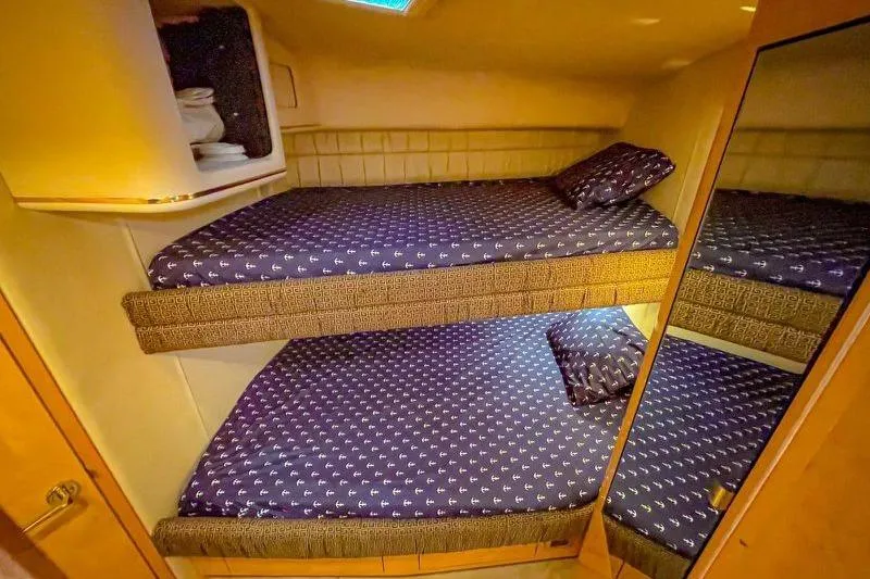  Yacht Photos Pics Bunk beds in 1998 Sea Ray 500 Sundancer yacht cabin with patterned bedding.