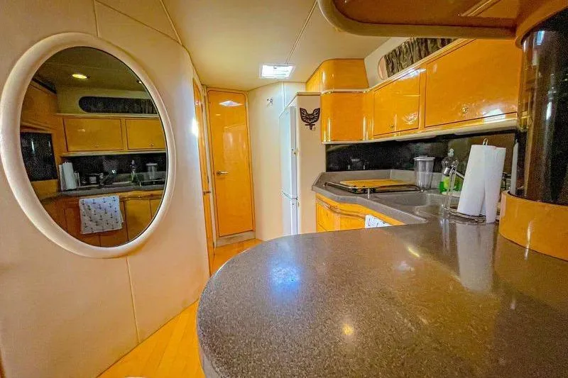  Yacht Photos Pics Interior of 1998 Sea Ray 500 Sundancer yacht with modern kitchen and sleek design.