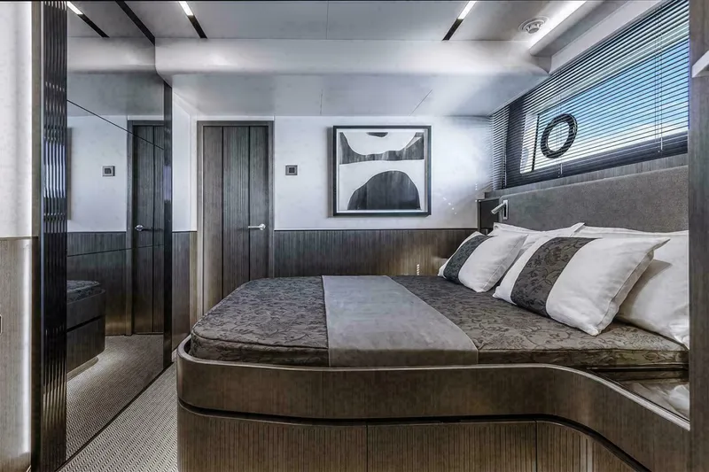 Pearl 72 Indulgence Yacht Photos Pics Luxurious bedroom interior in a 2025 Pearl 72 yacht, featuring modern design and elegant decor.