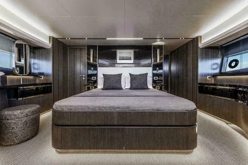 Pearl 72 Indulgence Yacht Photos Pics Luxurious bedroom interior of 2025 Pearl 72 yacht with modern design and elegant furnishings.