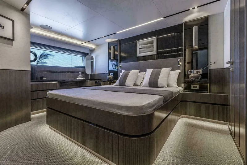 Pearl 72 Indulgence Yacht Photos Pics Luxurious bedroom interior in 2025 Pearl 72 yacht, featuring modern design and ambient lighting.