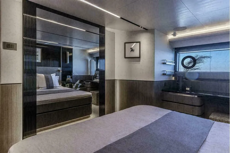 Pearl 72 Indulgence Yacht Photos Pics Luxurious bedroom interior on a 2025 Pearl 72 yacht, featuring modern design and elegant furnishings.