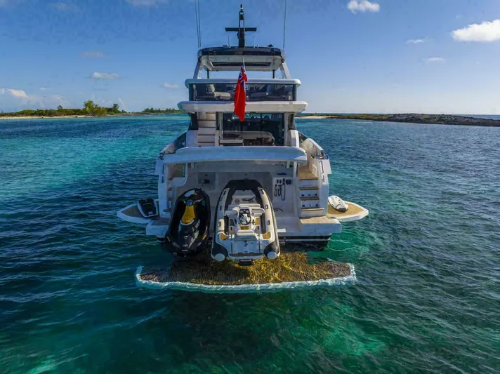 Pearl 72 Indulgence Yacht Photos Pics Luxurious Pearl 72 yacht, 2025 model, anchored in clear turquoise waters.