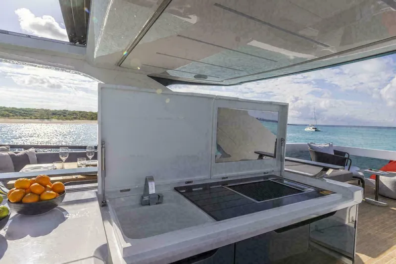 Pearl 72 Indulgence Yacht Photos Pics Luxury yacht Pearl 72 outdoor kitchen with ocean view, featuring modern amenities and sleek design, 2025 model.