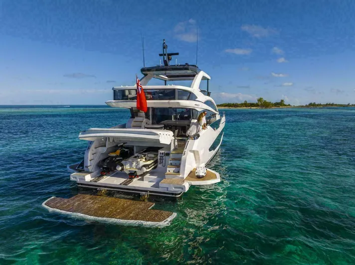 Pearl 72 Indulgence Yacht Photos Pics Luxury Pearl 72 yacht cruising in clear blue waters, 2025 model.