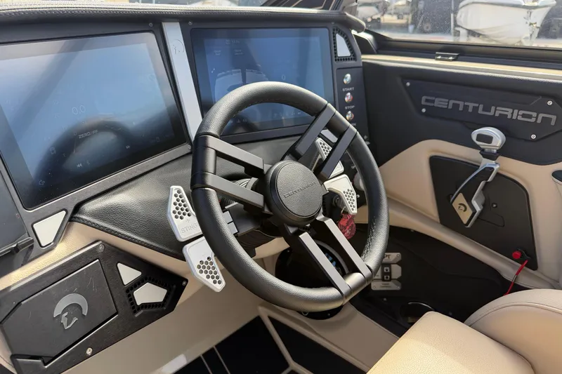  Yacht Photos Pics 2026 Centurion Ri230 boat dashboard with steering wheel and digital displays.