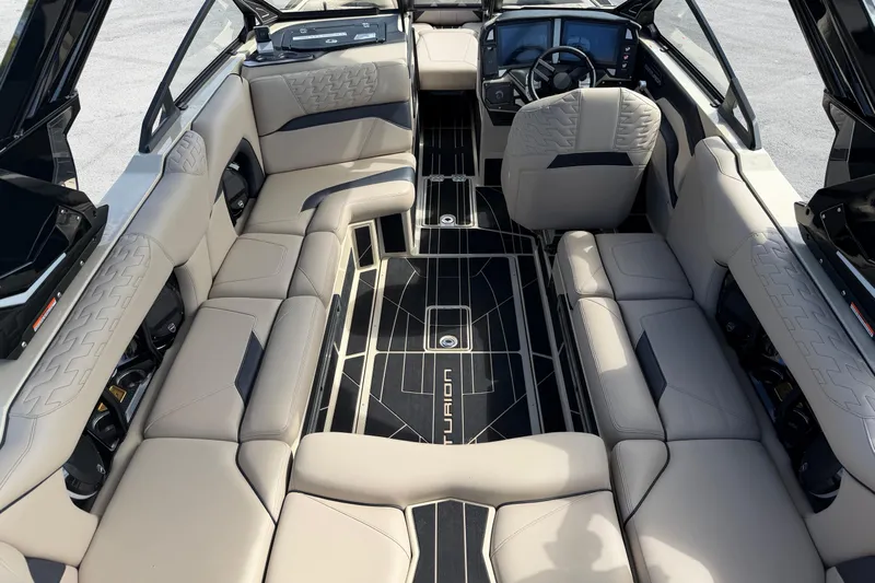  Yacht Photos Pics Luxurious interior of 2026 Centurion Ri230 boat with plush seating and modern dashboard.