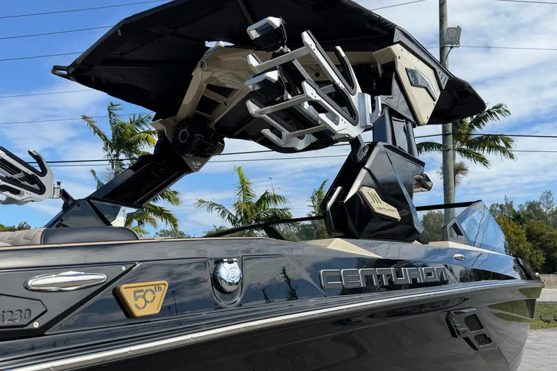  Yacht Photos Pics 2026 Centurion Ri230 boat with sleek design and advanced features, parked outdoors.