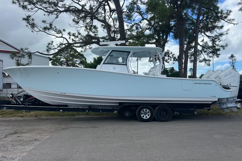  Yacht Photos Pics 2026 Sportsman Open 352 Center Console boat on trailer, parked outdoors.