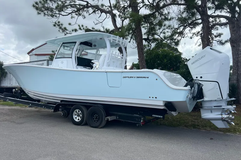  Yacht Photos Pics 2026 Sportsman Open 352 Center Console boat on trailer, parked outdoors.
