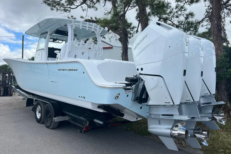  Yacht Photos Pics 2026 Sportsman Open 352 Center Console boat with triple Mercury outboard engines on a trailer.