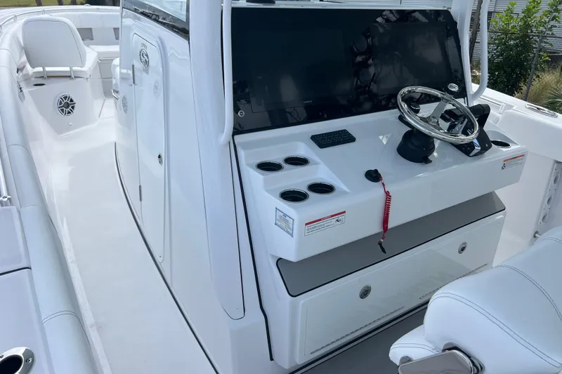  Yacht Photos Pics 2026 Sportsman Open 352 Center Console boat interior with steering wheel and seating.