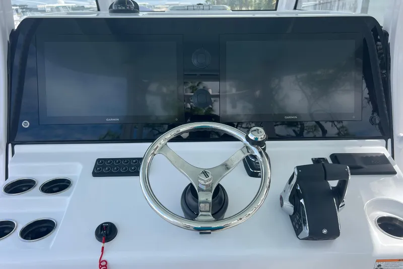  Yacht Photos Pics 2026 Sportsman Open 352 Center Console helm with dual Garmin displays and steering wheel.
