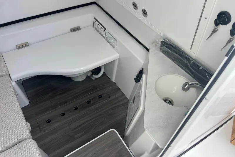  Yacht Photos Pics 2026 Sportsman Open 352 Center Console interior with sink and seating area.