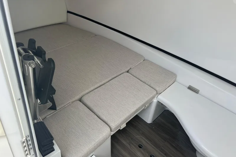  Yacht Photos Pics 2026 Sportsman Open 352 Center Console cabin interior with cushioned seating and modern design.